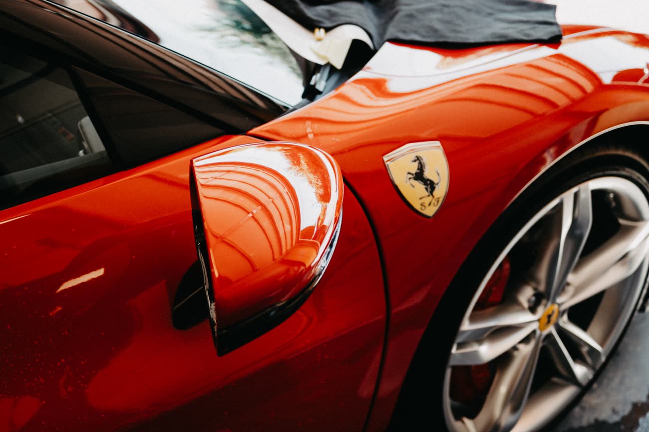 A freshly refinished car body with a deep, glossy factory finish