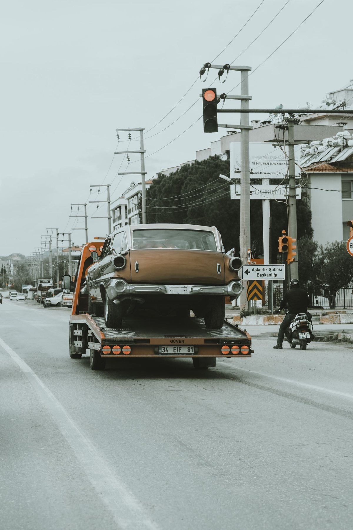 A vehicle loaded on a flatbed tow truck